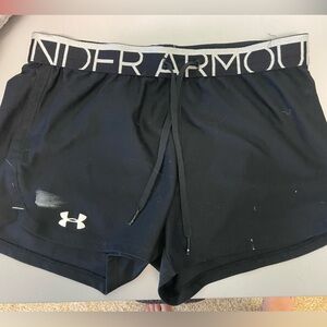 Small underarmour shorts with little paint on them